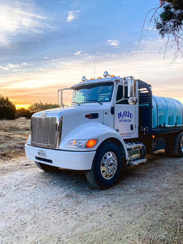 H2O2U water delivery truck on a Central Texas job site